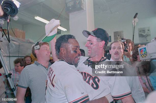 San Francisco: Giants' Kevin Mitchell and Will Clark celebrate National League Championship over Cubs.