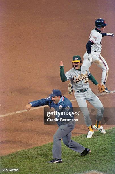 Dennis Eckersly as umpire Al Clark calls Brett Butler to the final out of the 1989 World Series. The A's won 9-6.