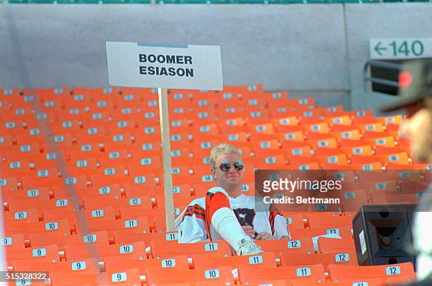 Miami: Cincinnati Bengals' quarterback Boomer Esiason sits quietly in the stands of Joe Robbie Stadium before the hundreds of sports writers and...