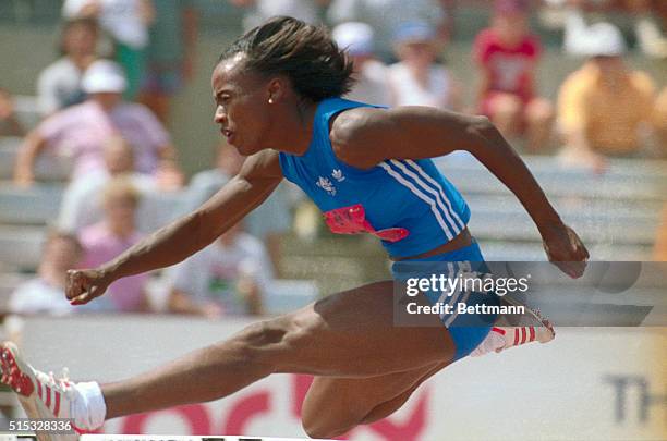 Jackie Joyner-Kersee of long Beach California, clears a hurdle July 15 on the way to an American record in the heptathlon 100 meter hurdles, during...