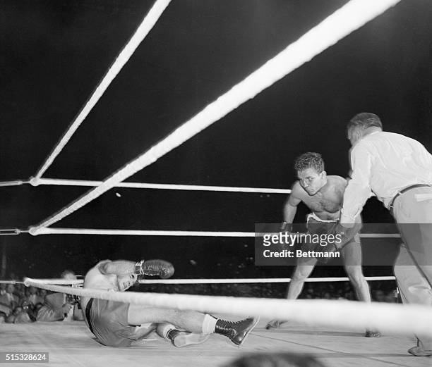 Marcel Cerdan hits the canvas in the first round of his middleweight title bout with Jake Lamotta here. Cerdan immediately got up, and there were no...
