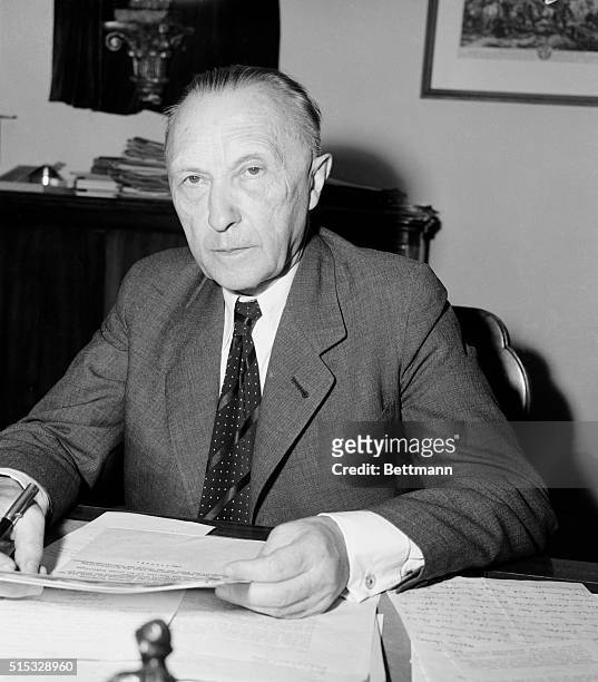 Awaits Appointment. Bonn, West Germany: Dr. Konrad Adenauer leader of the Christian Democrats, sits at his desk in his residence near Bonn. He will...