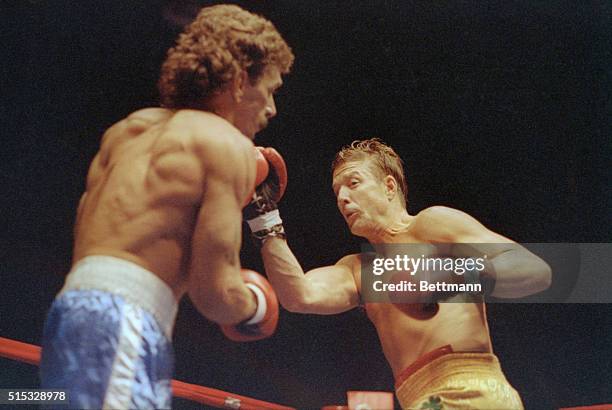 Actor Mickey Rourke lays into his opponent Steve Powell during fourth round action 5/23. Rourke won the fight in a unanimous decision in his first...