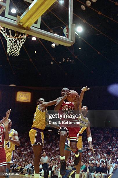 Michael Jordan blows past James Worthy and Byron Scott for a layup 6/9.