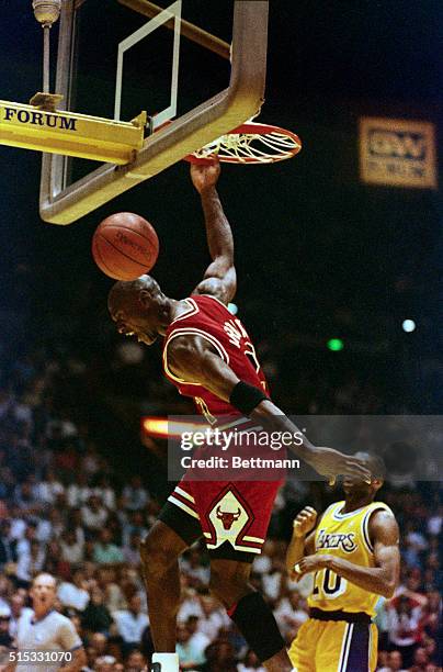 Chicago Bulls' guard Michael Jordan slams home a dunk in the second quarter of game 5 of the NBA finals against the Los Angeles Lakers at the Forum...