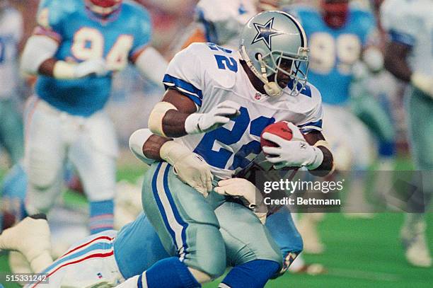 Dallas Cowboys' Emmitt Smith is caught from behind by Houston Oilers' defender in the first quarter of Dallas Houston preseason game, 8/18.