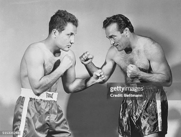 Detroit, Michigan: Marcel Cerdan, right, of France, World Middleweight Champion, and challenger Jake LaMotta of New York strike a fighting pose...