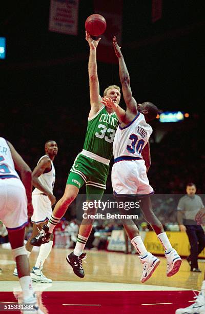 Boston's Larry Bird shoots over Washington's Bernard King in the first period action at the Capital Center 11/17.