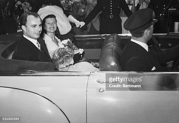Prince Aly Khan and his bride, actress Rita Hayworth, leave the Vallauris Town Hall after their double ring wedding ceremony,May 27th. A reception as...