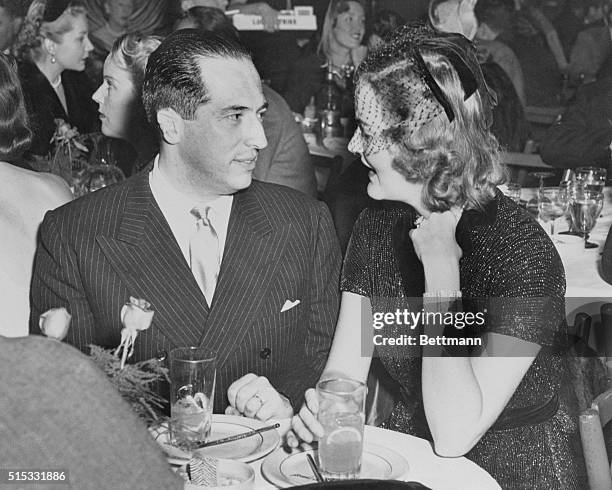 Francisco Urrutia, of Columbia, and heiress Doris Duke give an international flavor to the El Morocco Night Club as they are seen together chatting...
