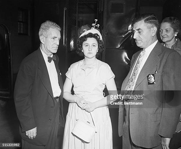 August 23, 1950 - New York: U.S. Deputy Marshals Harry McCabe and James A. Shannon escort Mrs. Ethel Rosenberg of New York, as she appears in Federal...