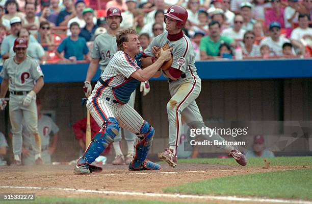 New York: John Morris of the Philadelphia Phillies is out at the plate as New York Mets' catcher Mackey Sasser puts on a good block at Shea Stadium....