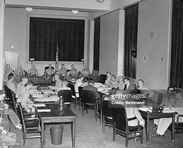 The third day of the trial of 8 Nazi saboteurs opened July 11th in the Department of Justice Building on the fifth floor. Here we see the men sitting...