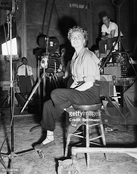 Ingrid Bergman relaxing between takes of For Whom the Bell Tolls, directed by Sam Wood, 1943.