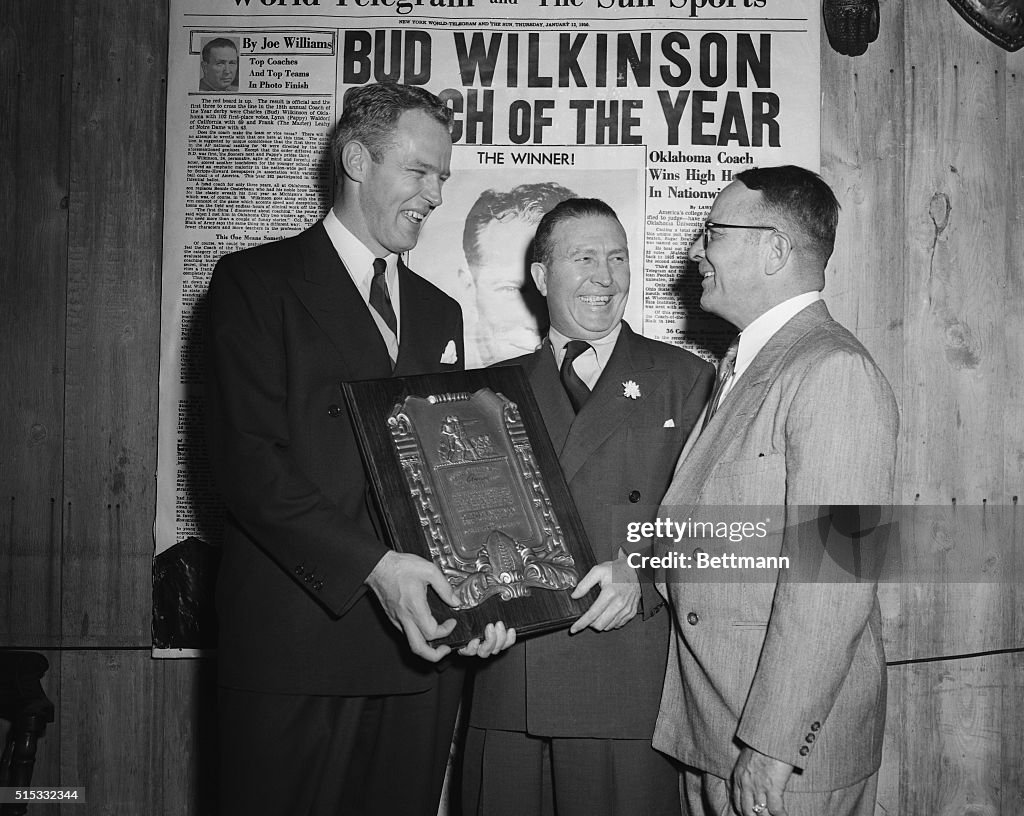 Coach Charles "Bud" Wilkinson Holding Coach Award with Others
