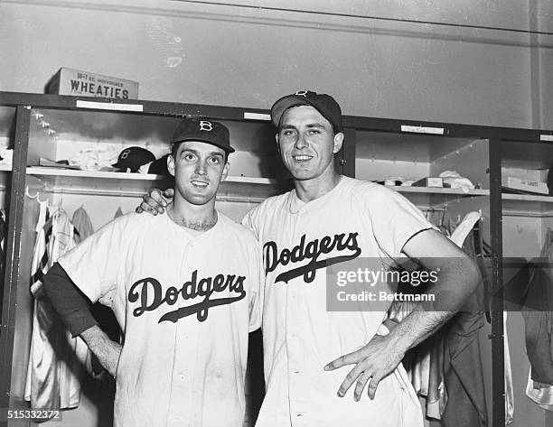 Brooklyn Dodgers first baseman Gil Hodges, and pitcher Carl Erskine are shown here for their impressive batting performance in the August 31st night...