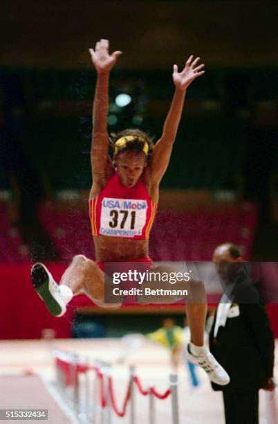 Jackie Joyner-Kersee leaps 22 feet, 5 1/4 inches on her second jump to win the Women's Long Jump at the USA/mobil Indoor Track and Field...