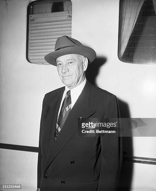 New York, NY: Close-up of Conrad Hilton, Sr., President of the Hilton Hotel Company, as he returns from a business trip in Europe aboardthe SS...