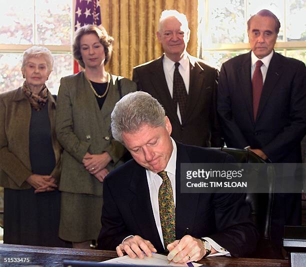 President Bill Clinton signs S.1652 designating the Old Executive Office Building next door to the White House as the Dwight D. Eisenhower Executive...