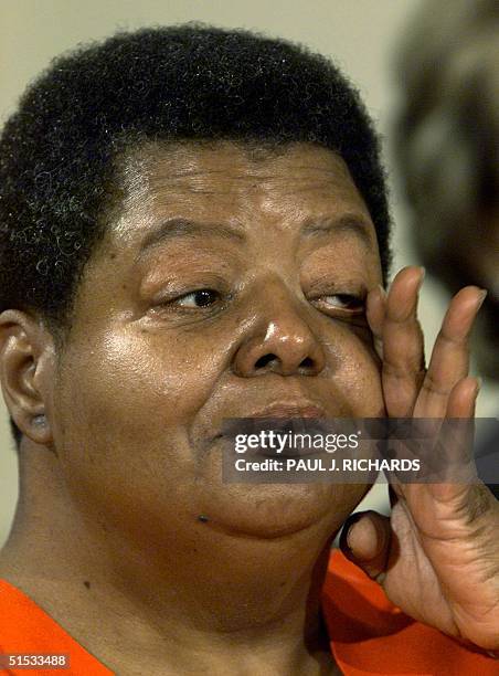 Elizabeth Eckford wipes her eyes during the presentation of the Congressional Gold Medal to the members of the Little Rock Nine 09 November in the...