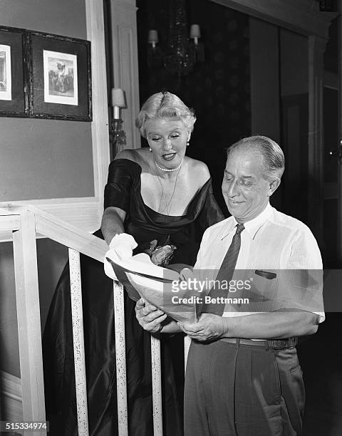 Film actress Ginger Rogers matches this lively facial expression to a line of dialogue as she goes over the script of Love and Let Love, the play...