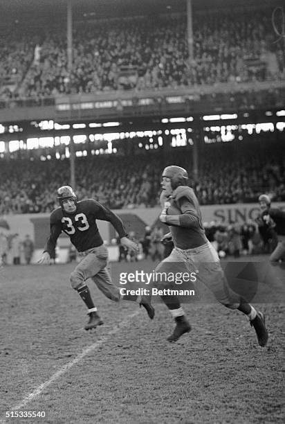 It's Sam Baugh Redskin halfback, coming in for a tackle after Bill Paschal , New York Giant fullback carried the ball for 35 yards. The Giants won...