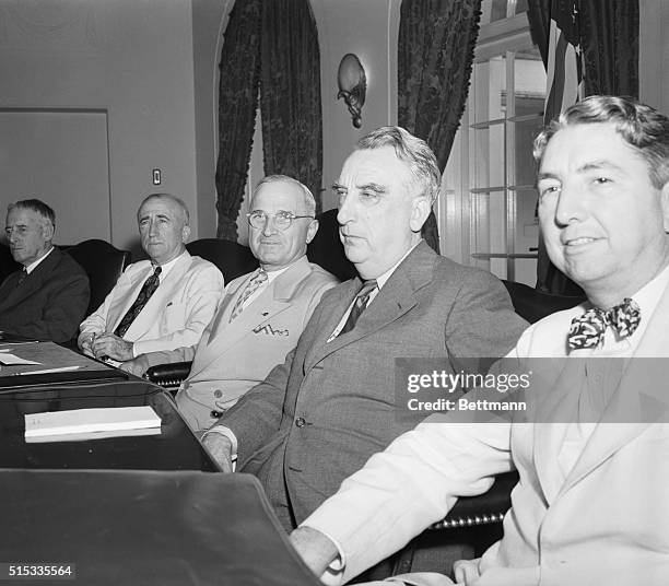 President Harry S. Truman is shown with some of his cabinet members during special session called this afternoon to discuss Jap surrender offer. Left...
