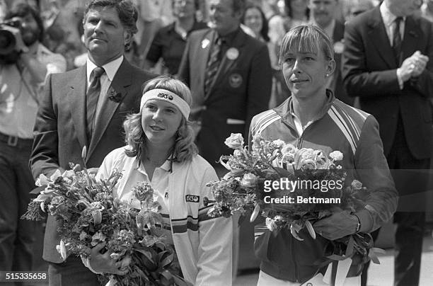 Americans Andrea Jaeger and Martina Navratilova hold bouquets after their Women's Singles Final at Wimbledon, London. Navratilova won the title in...