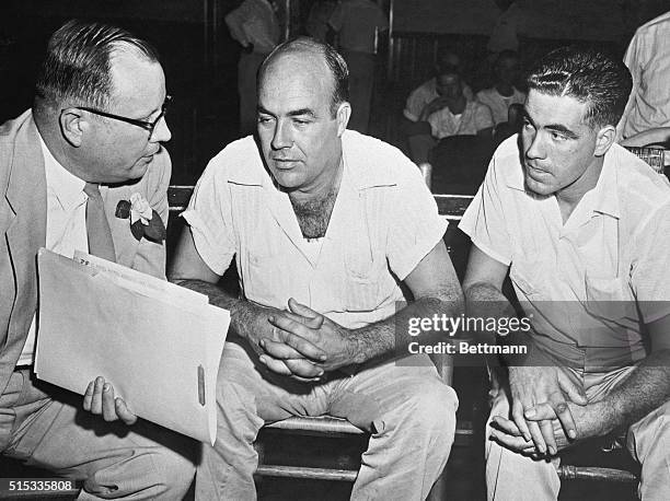 Half-brothers J.W. Milam and Roy Bryant confer with attorney Sidney Carlton on murder and kidnapping charges facing them in the death of 14-year-old...