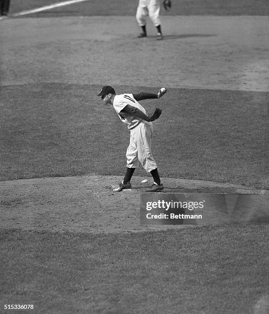 Working on a two-hitter, Vic Raschi of the New York Yankees gets set to pitch to Joe Gordon of the Cleveland Indians in the ninth inning of game at...