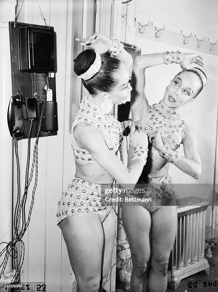 Janet Collins Adjusting Her Costume for Ballet Performance