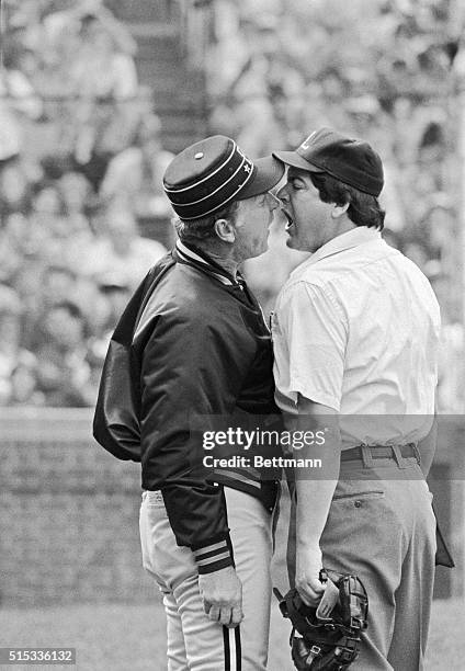 Pittsburgh Pirates manager Chuck Tanner and plate umpire Jerry Crawford are nose to nose and mouth to mouth as they try to out-shout each other when...