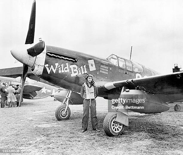 England: Californian Poses With His Fighter. Lt. William Simmons of Los Angeles, California, member of the 9th Air Force fighters, poses in front of...