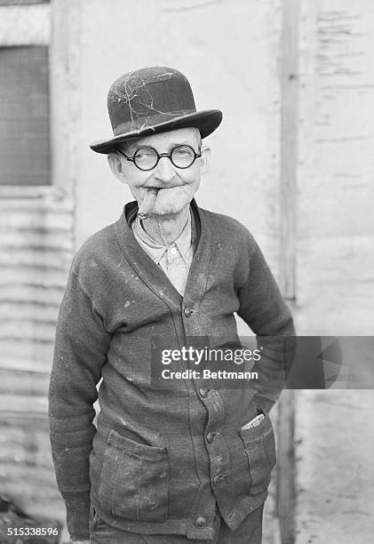 Close-up of C. A. Morris, age 70 years, who has worn only derby hats for 57 years. "Charlie" wore his first derby when he was 13 years old. "And if I...
