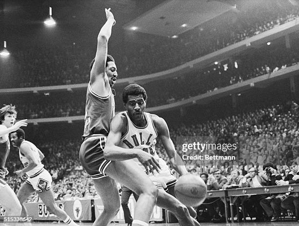 Bulls' forward Bob Love dribbles ball around KC-Omaha Kings' Ron Behagen in the first period at Chicago Stadium during NBA playoffs. The Bulls won,...