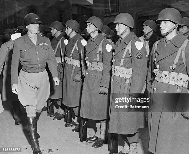 Lt. General George S. Patton, Jr., who commanded the U. S. Seventh Army in the Sicilian campaign is shown inspecting U. S. Troops in Britain shortly...