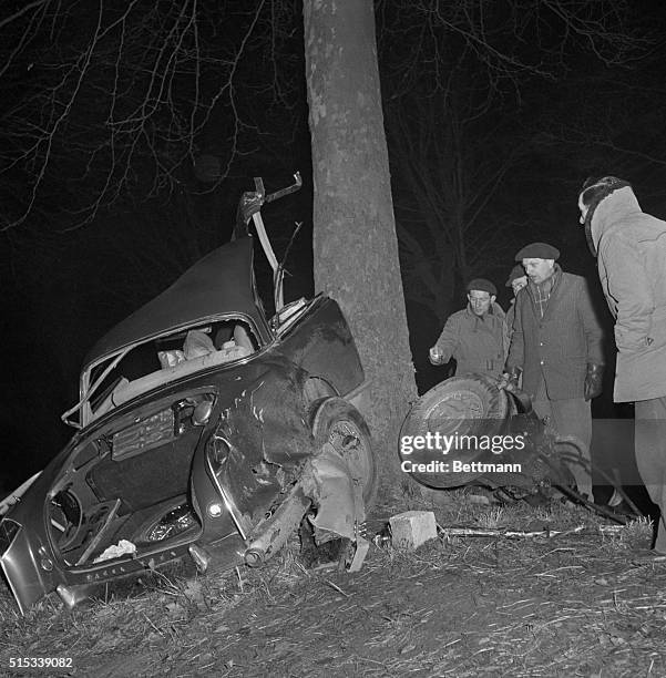 Rescuers take a last look at the shattered wreck of the powerful, custom built Facel Vega auto in which famed French author Albert Camus met death...
