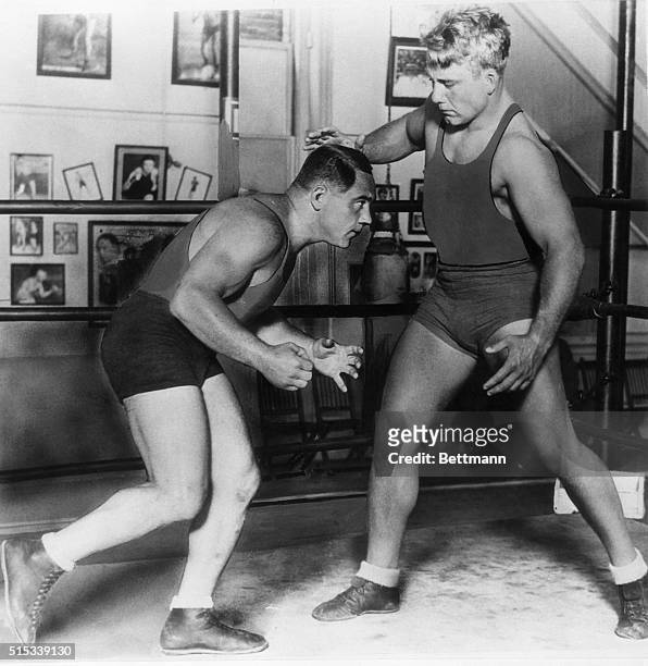 This is how Champion Gus Sonnenberg, left, and Challenger Everett Marshall will square off in their World's Championship wrestling match at Wrigley's...