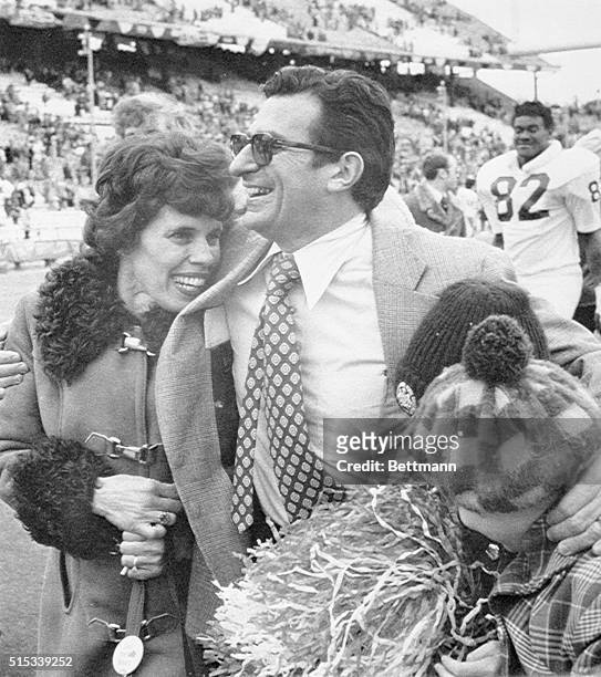 Penn State coach Joe Paterno hugs his kids and his wife Sue after his Nittany Lions scored a runaway 41-20 victory over the Sears of Baylor...