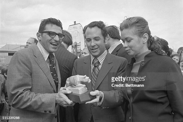 Penn State coach Joe Paterno, , presents a statue of the "Nittany Lion," the school's athletic symbol, to Dallas Mayor Wes Wise, , as the team...
