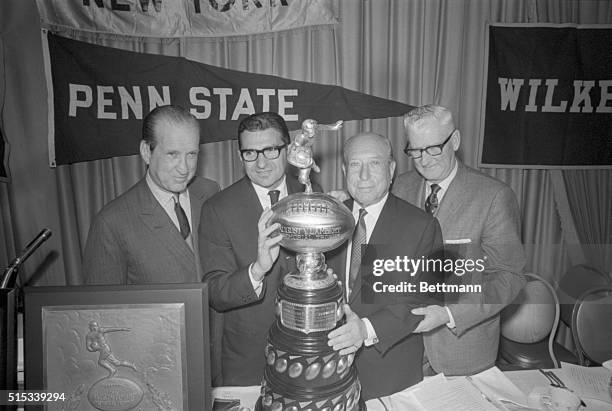Representatives of Penn State, which Dec. 7th completed the best football season in its 82-year history, accept the 1968 Lambert Trophy during...