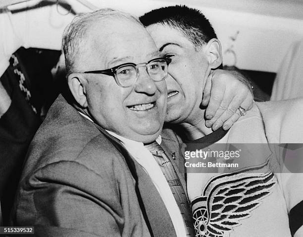 Red Wings' General Manager Jack Adams gives Detroit goalie Terry Sawchuck a hug after the player shut out the Montreal Canadiens 6-0, giving the Red...