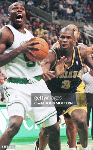 Indiana Pacers Al Harrington tries to defend against Eric Williams of the Boston Celtics during the first half of action at the Fleet Center in...