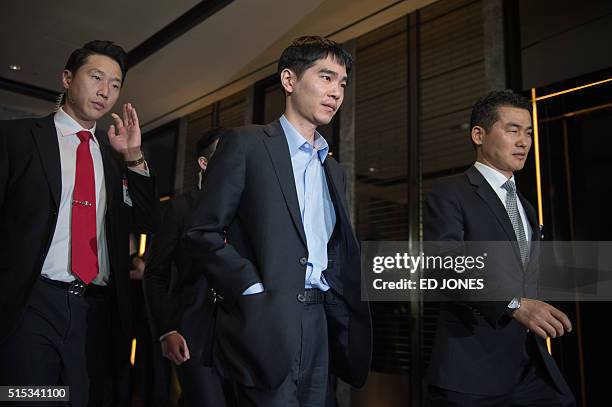 'Go' player Lee Se-Dol leaves the game room for a post-match press conference after his first win against a Google-developed super-computer, in Seoul...