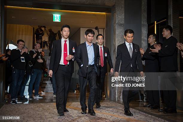 'Go' player Lee Se-Dol leaves the game room for a post-match press conference after his first win against a Google-developed super-computer, in Seoul...