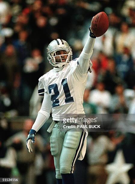 Dallas Cowboys defensive back Deion Sanders acknowleges the cheering crowd after intercepting his first pass of the game versus the Miami Dolphins at...