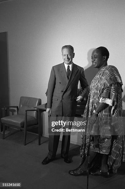 The flags of the United Nations fly in the backgroun as Prime Minister Kwame Nkrumah of Ghana and Ghana's Ambassador to the U.S. Leave after visiting...