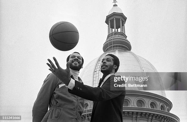 On tip of the world and the State House are Rutgers basketball stars Phil Sellers and Mike Dabney. The tall two were honored by the legislature and...