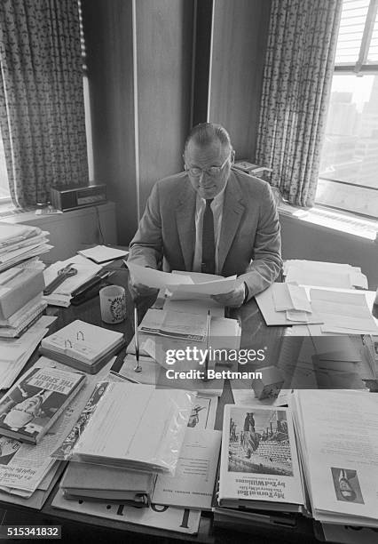 In a proud moment at his Fifth Avenue office, Baseball Commissioner Bowie Kuhn reads the list of the ballplayers named to the 1969 All-Star team....