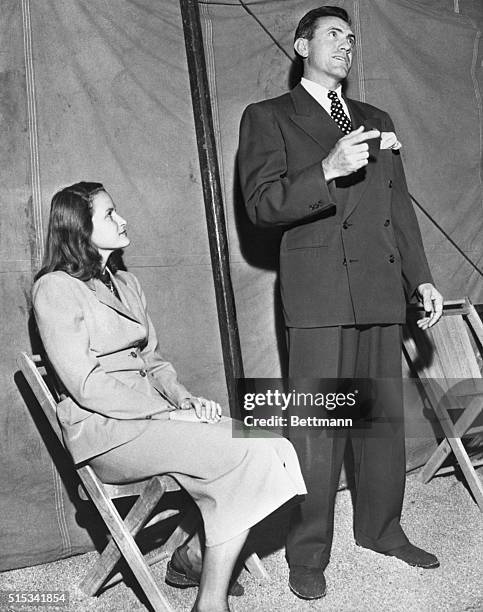 Lou Zamperini, former West coast and track field star at the University of Southern California, is shown with his wife as he made a profession of...